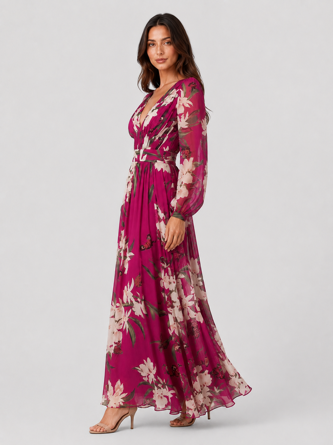 Woman wearing a lightweight floral chiffon maxi dress with a flowing, relaxed silhouette. The dress features an all-over floral print and breathable fabric that drapes softly for comfortable movement. Suitable for warm-weather occasions, casual outings, daytime events, and holiday wear.