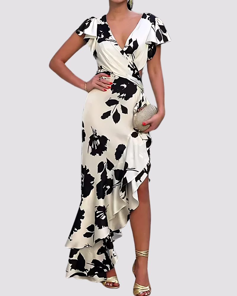 Women’s floral maxi summer dress featuring an all-over floral print, fit-and-flare silhouette, and flowing flared skirt. Made from a soft breathable fabric blend for lightweight comfort and easy movement.