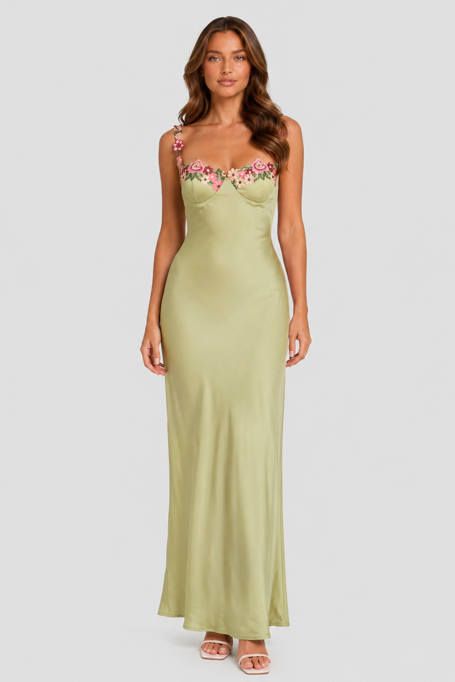 Women's floral strap maxi dress in light green featuring delicate flower embellishments, a fitted bodice, and a flowing skirt for weddings and summer occasions.