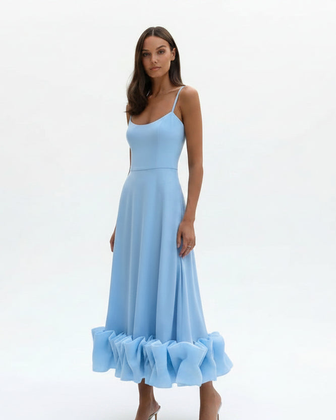 Women’s flowing midi dress with defined waist and lightweight fabric
