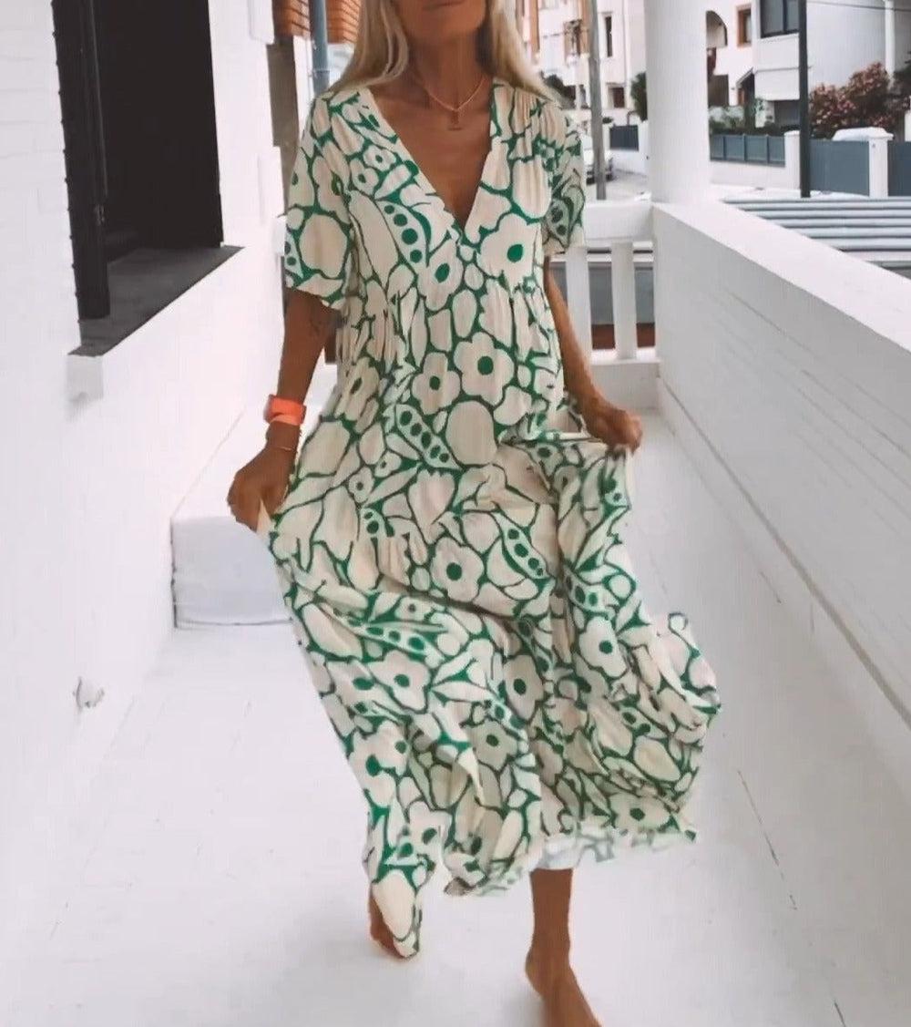 Women’s green printed short sleeve maxi dress with V neck and A-line silhouette in stretch fabric