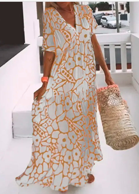 Women’s green printed short sleeve maxi dress with V neck and A-line silhouette in stretch fabric