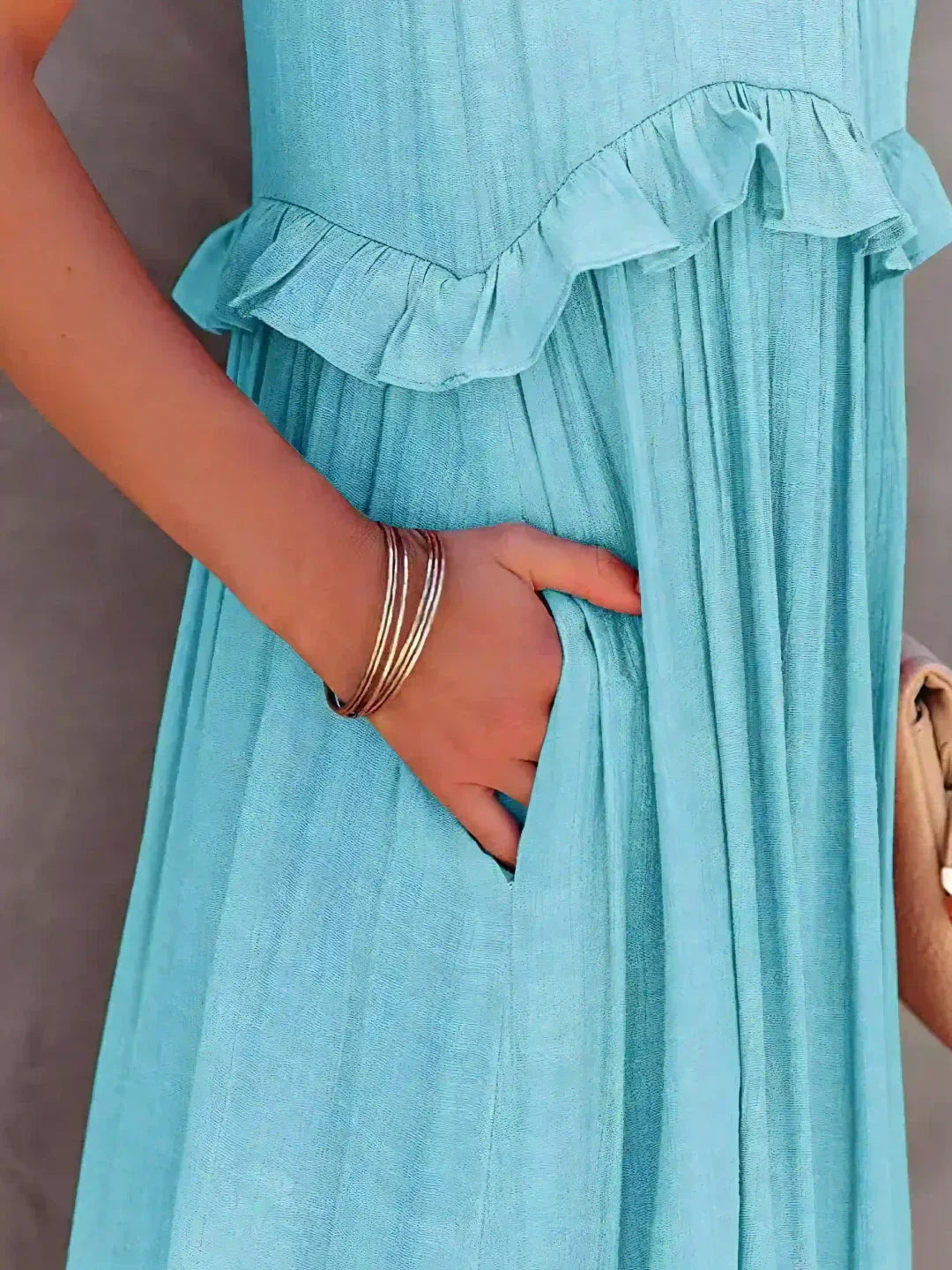 Women’s halterneck ruffle maxi dress with pockets and flowing silhouette