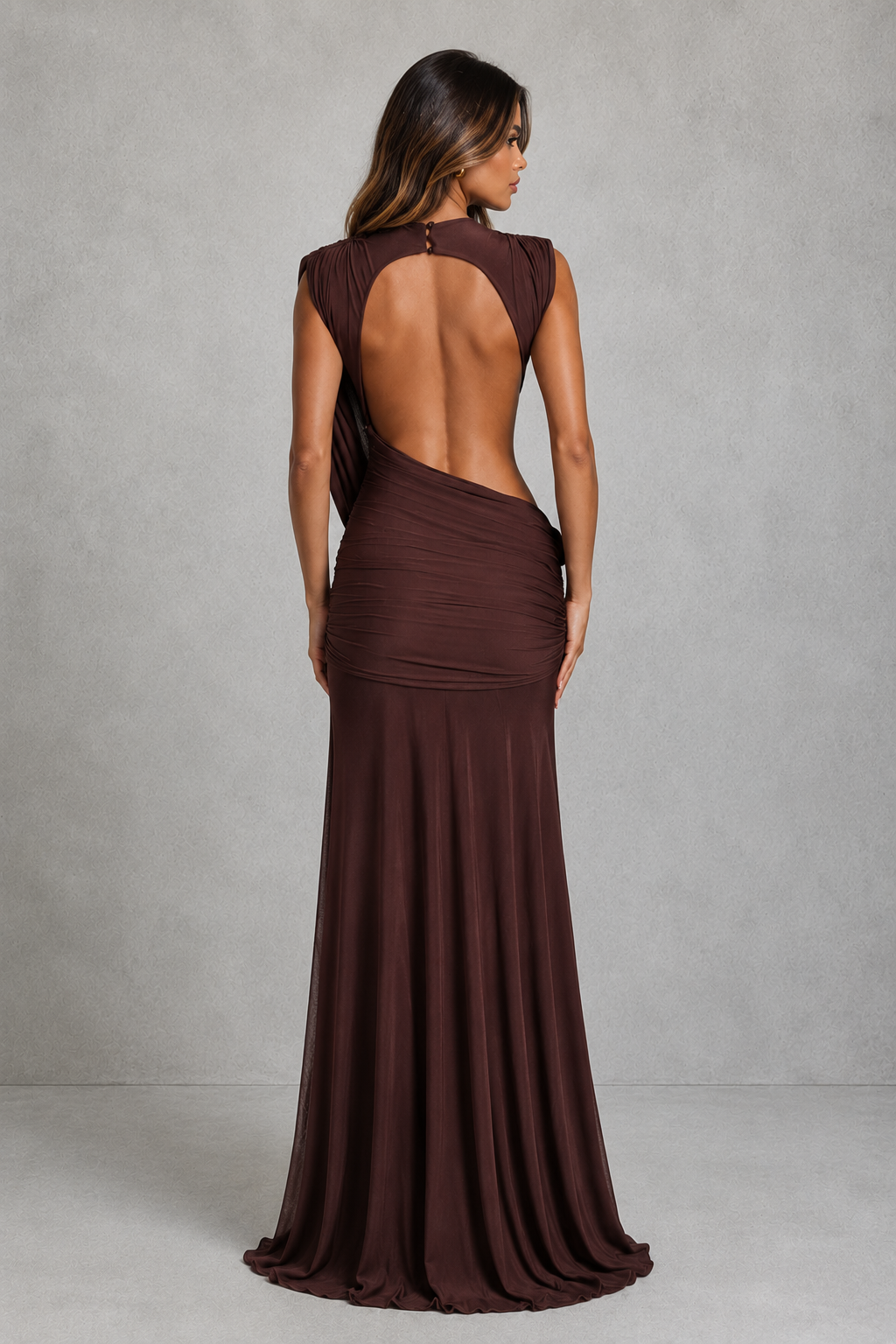 Women’s high neck mesh maxi dress with diagonal sash detail, ruched hips, asymmetric open back and flowing flared skirt.