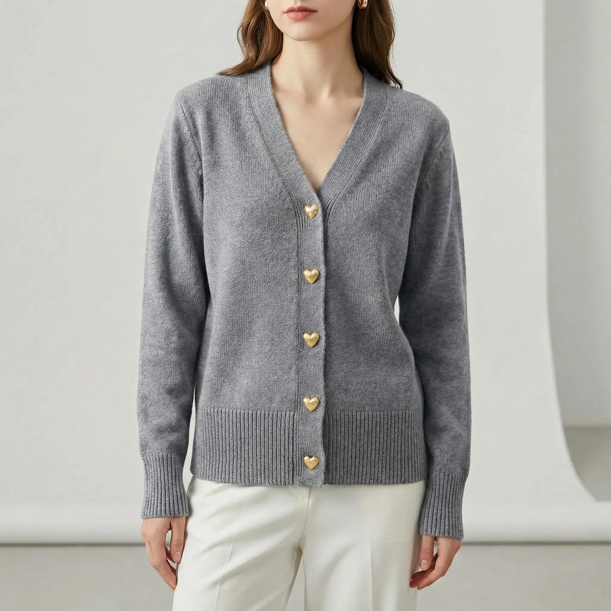 Women’s hip-length knit cardigan with V-neck and button-front closure