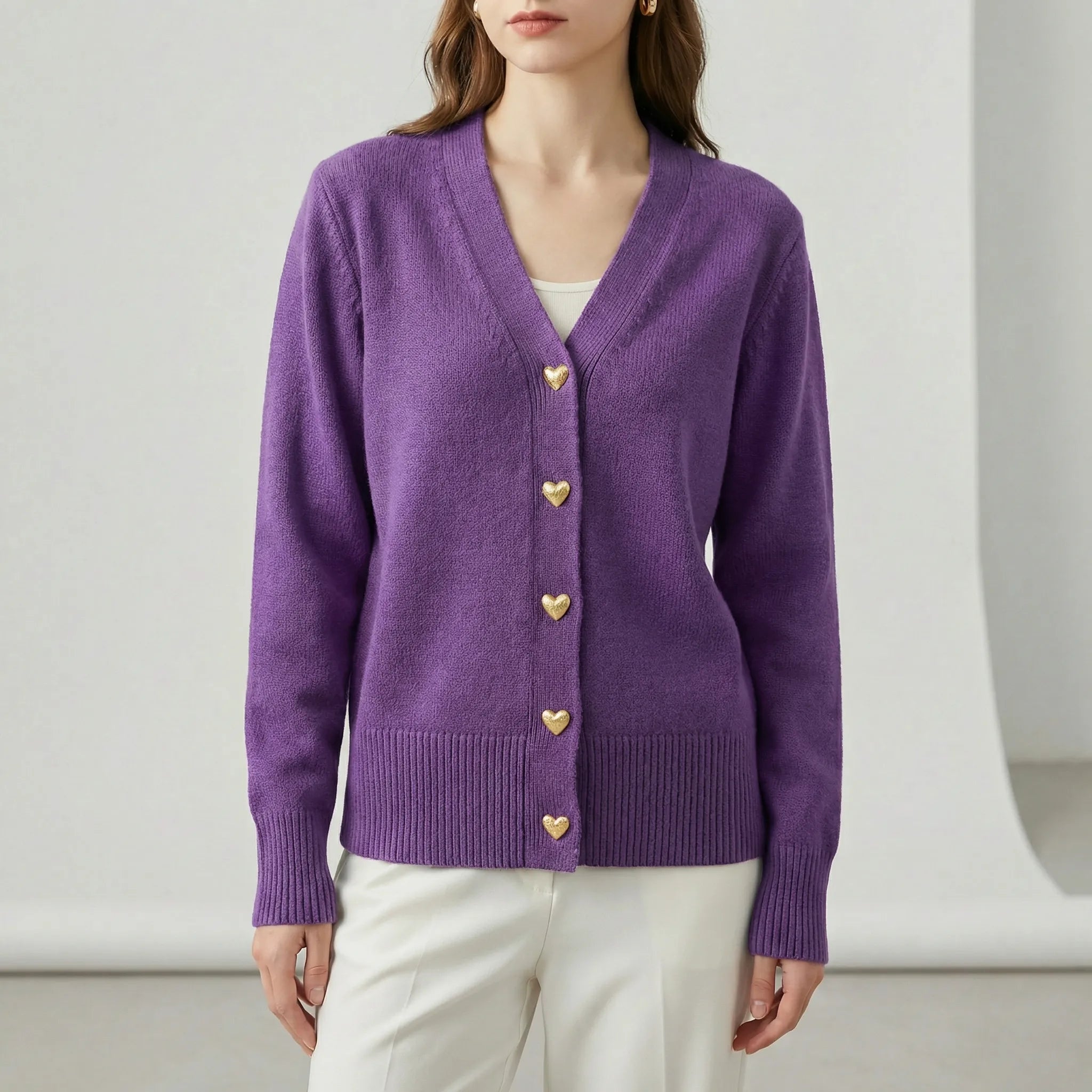 Women’s hip-length knit cardigan with V-neck and button-front closure