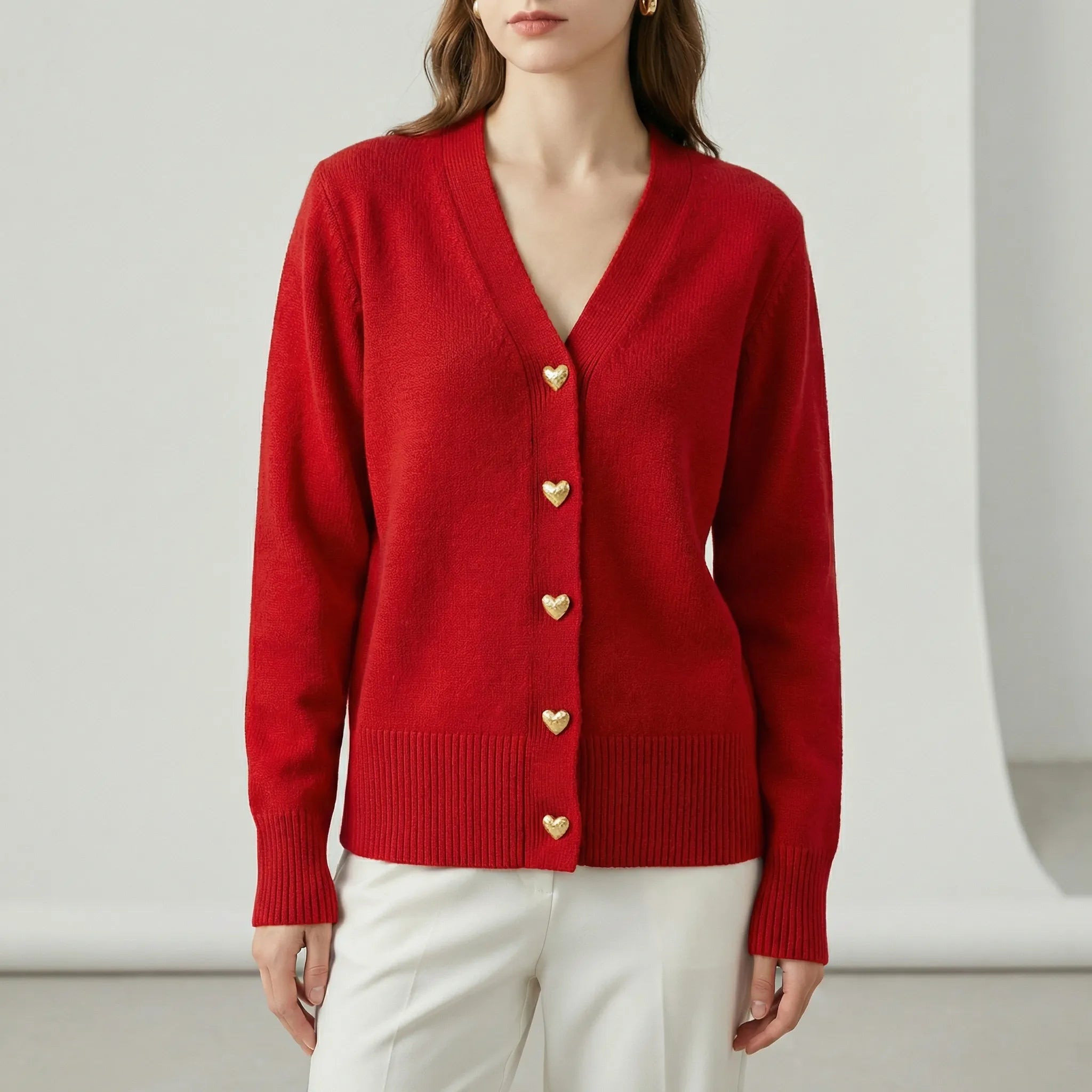 Women’s hip-length knit cardigan with V-neck and button-front closure