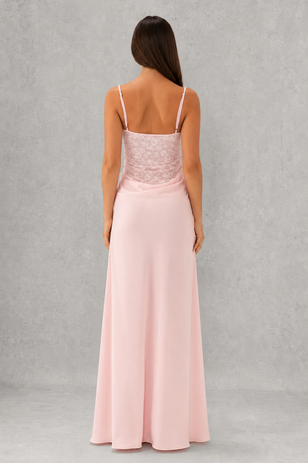 Women's lace bodice maxi dress with pleated cups, adjustable shoulder straps, draped hip detail, and a flowing skirt, designed for evening events, weddings, and formal occasions.