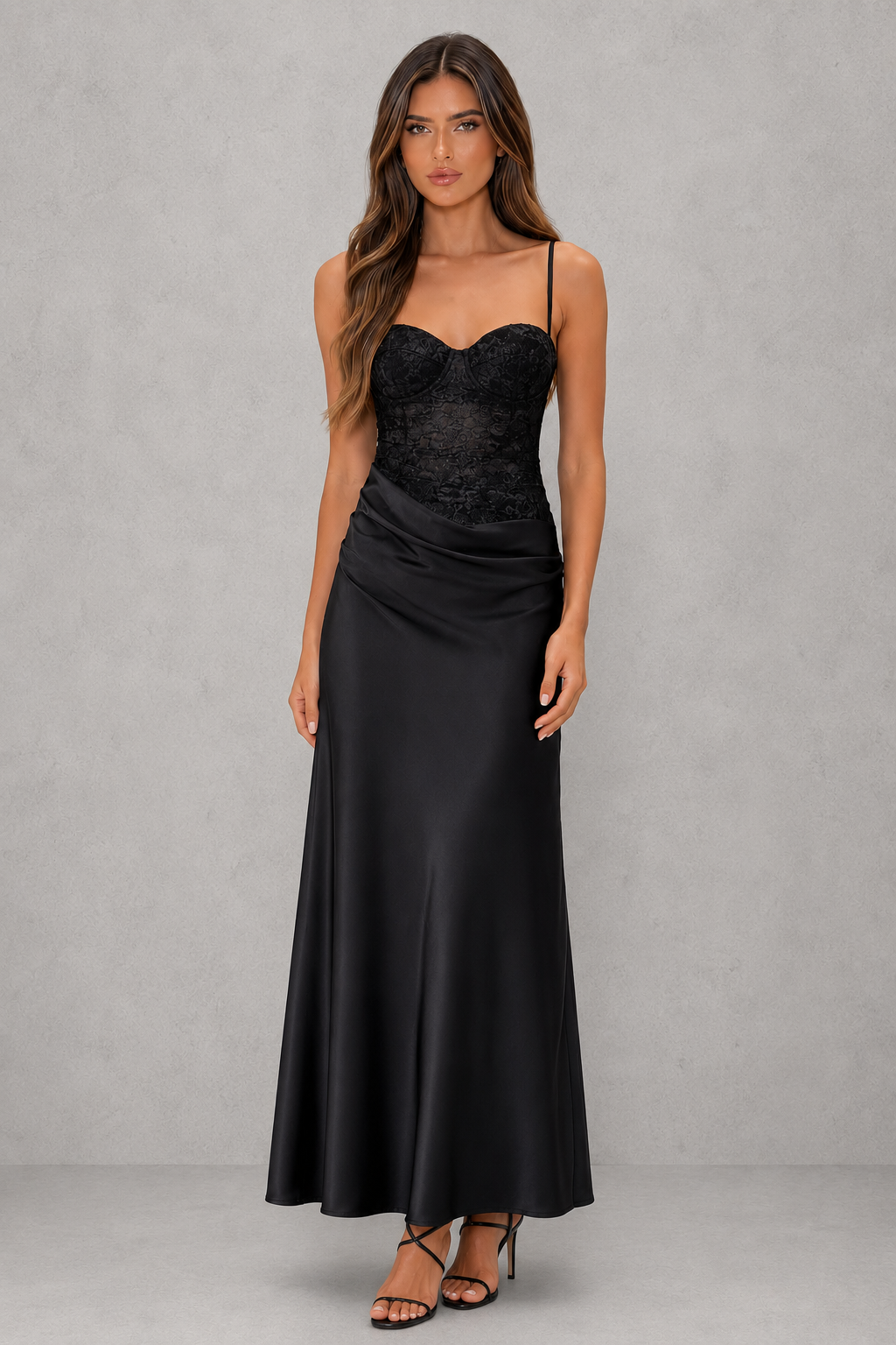 Women's lace bodice maxi dress with pleated cups, adjustable shoulder straps, draped hip detail, and a flowing skirt, designed for evening events, weddings, and formal occasions.