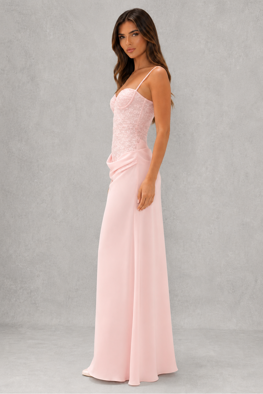 Women's lace bodice maxi dress with pleated cups, adjustable shoulder straps, draped hip detail, and a flowing skirt, designed for evening events, weddings, and formal occasions.