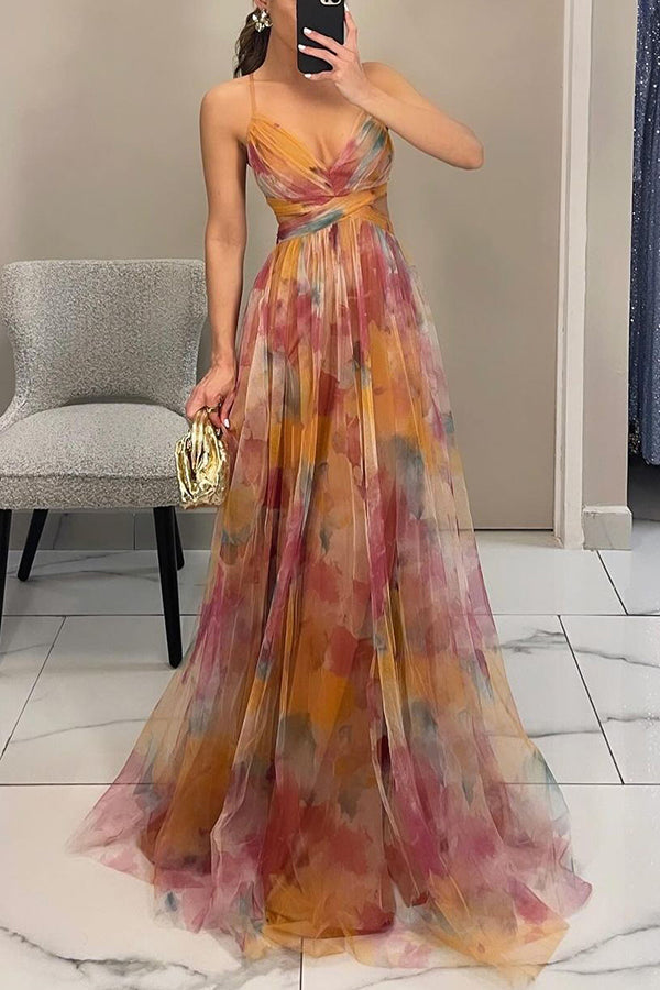 Women’s layered formal dress with flowing silhouette and soft painterly colors