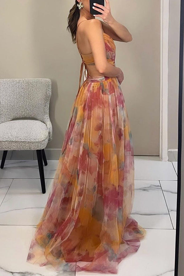 Women’s layered formal dress with flowing silhouette and soft painterly colors