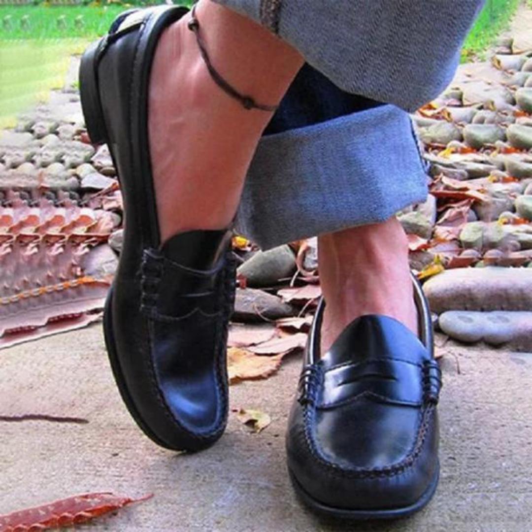Women’s leather slip-on loafers with moc toe stitching