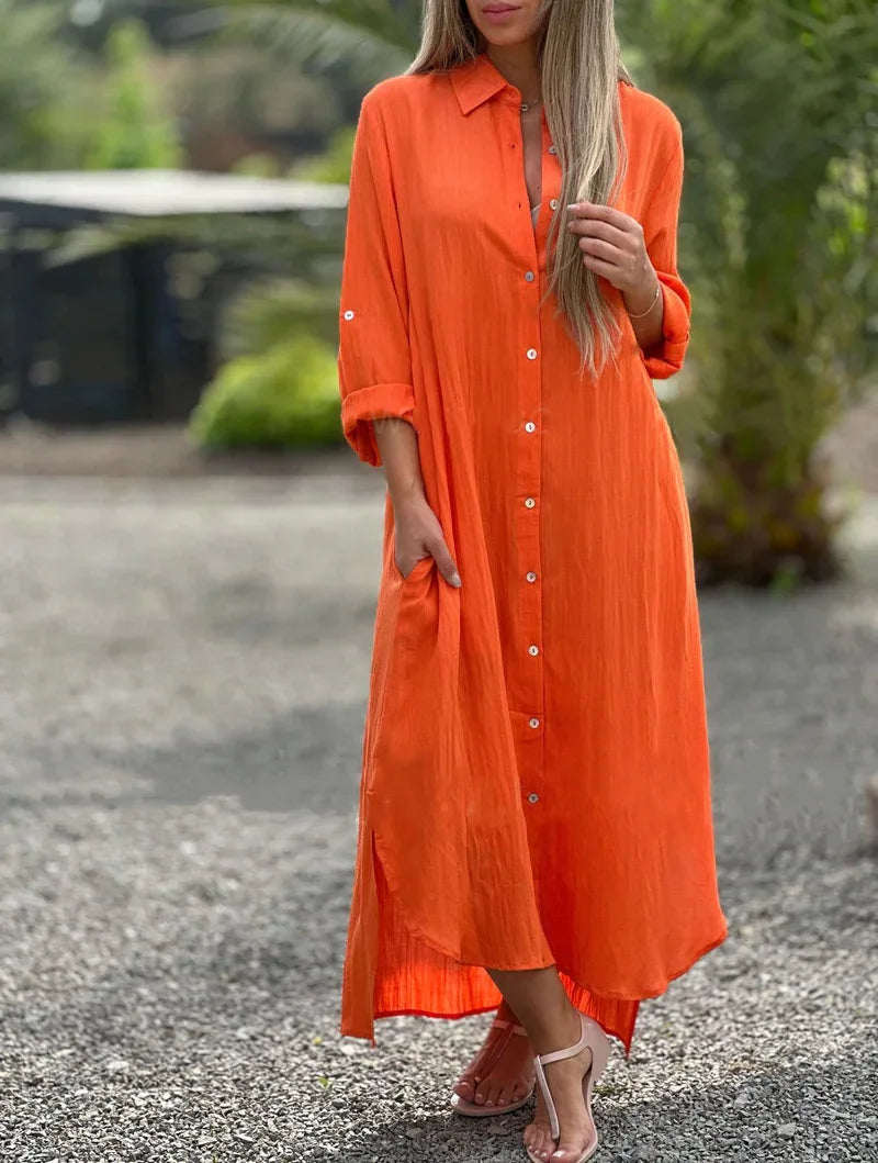 Women's light pink shirt dress with button front, relaxed fit, and casual feminine style