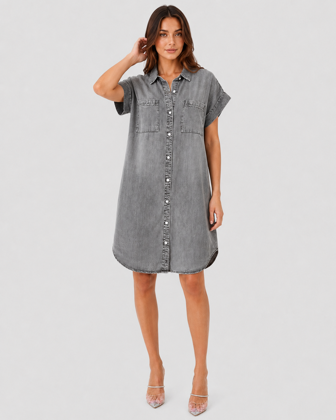 Woman wearing a light blue lightweight summer mini dress with a relaxed fit against a neutral background.