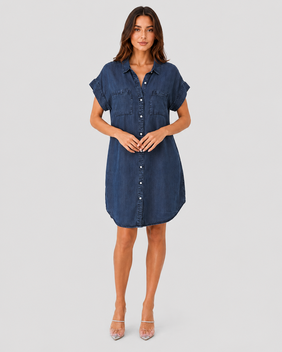 Woman wearing a light blue lightweight summer mini dress with a relaxed fit against a neutral background.