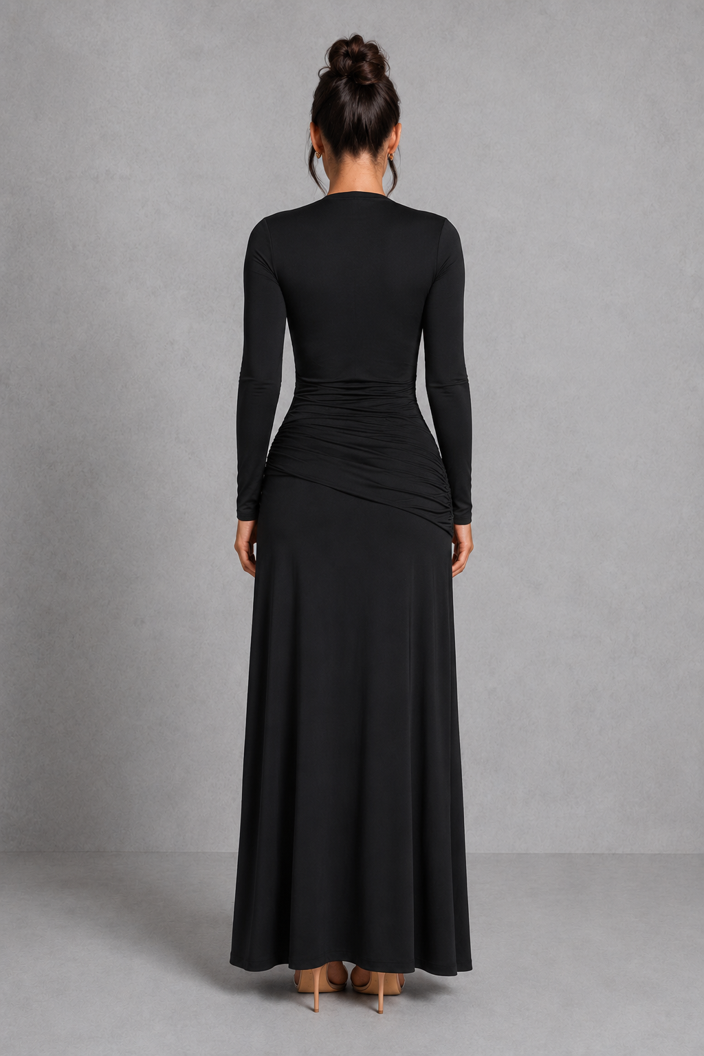 Women’s long sleeve maxi evening dress featuring a deep plunge neckline, fitted ruched bodice, knot detail at the hip, and a thigh-high split. Designed with a figure-flattering silhouette and elegant movement for formal events, parties, and special occasions.