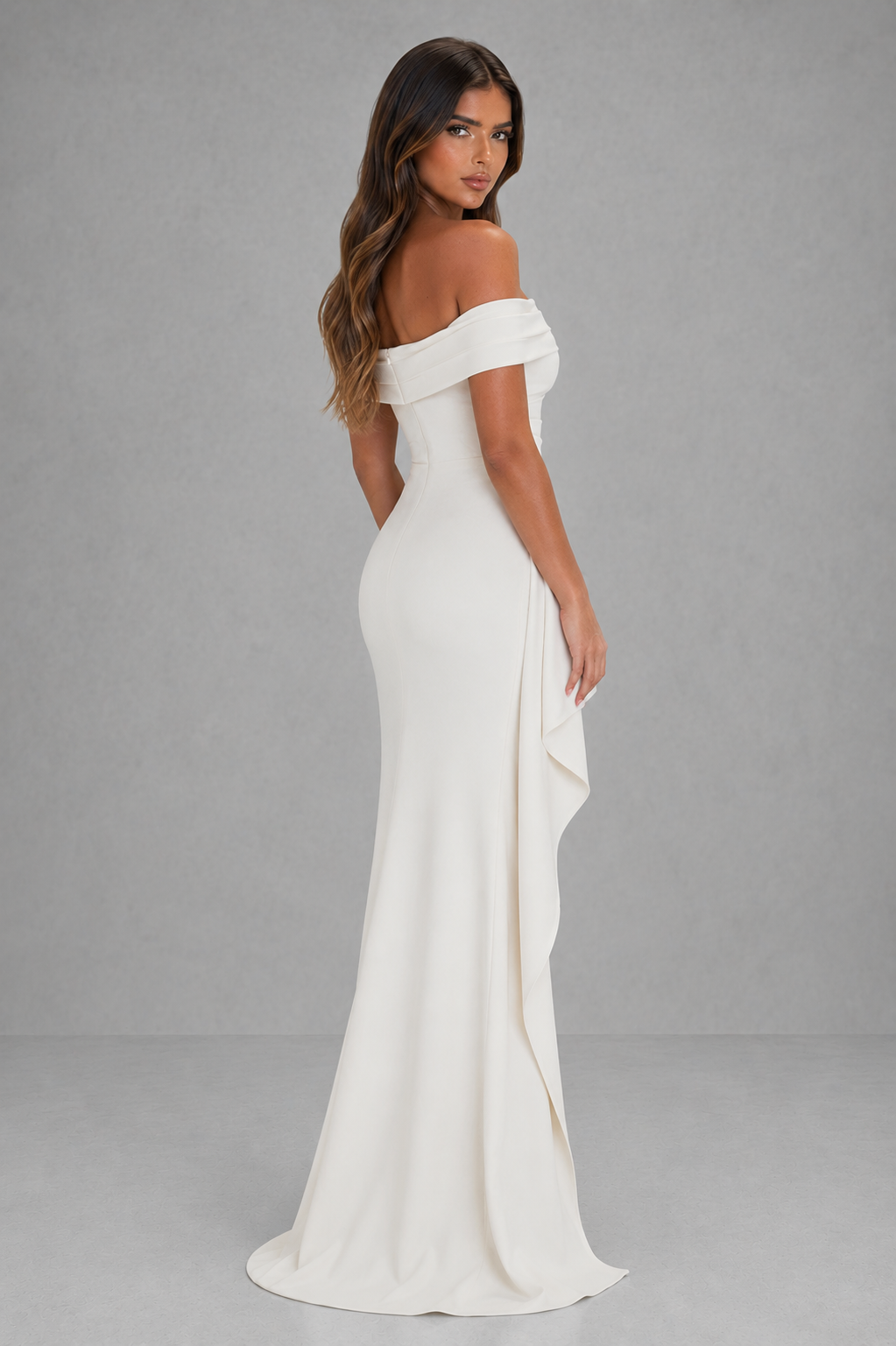 Woman wearing a women’s off shoulder stretch crepe maxi dress featuring a Bardot neckline, flattering side gather detail, body-contouring silhouette, and thigh-high side split, creating an elegant look for formal events, weddings, and evening occasions.