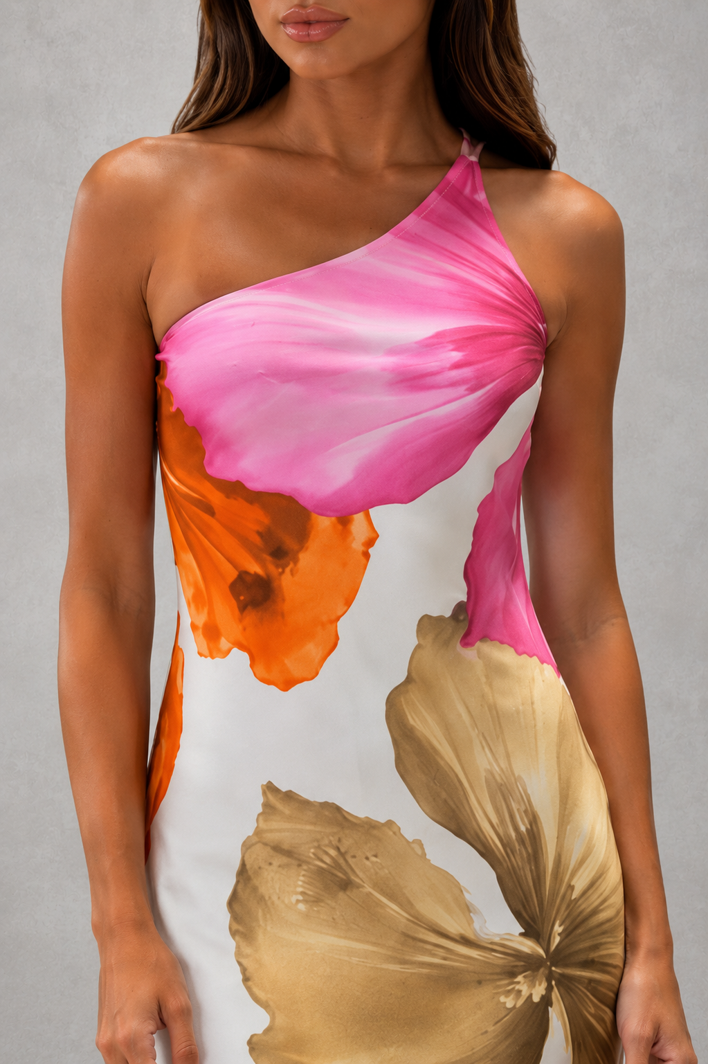 Women’s one-shoulder floral maxi dress with oversized botanical print, flowing silhouette and feminine ruffle hem.