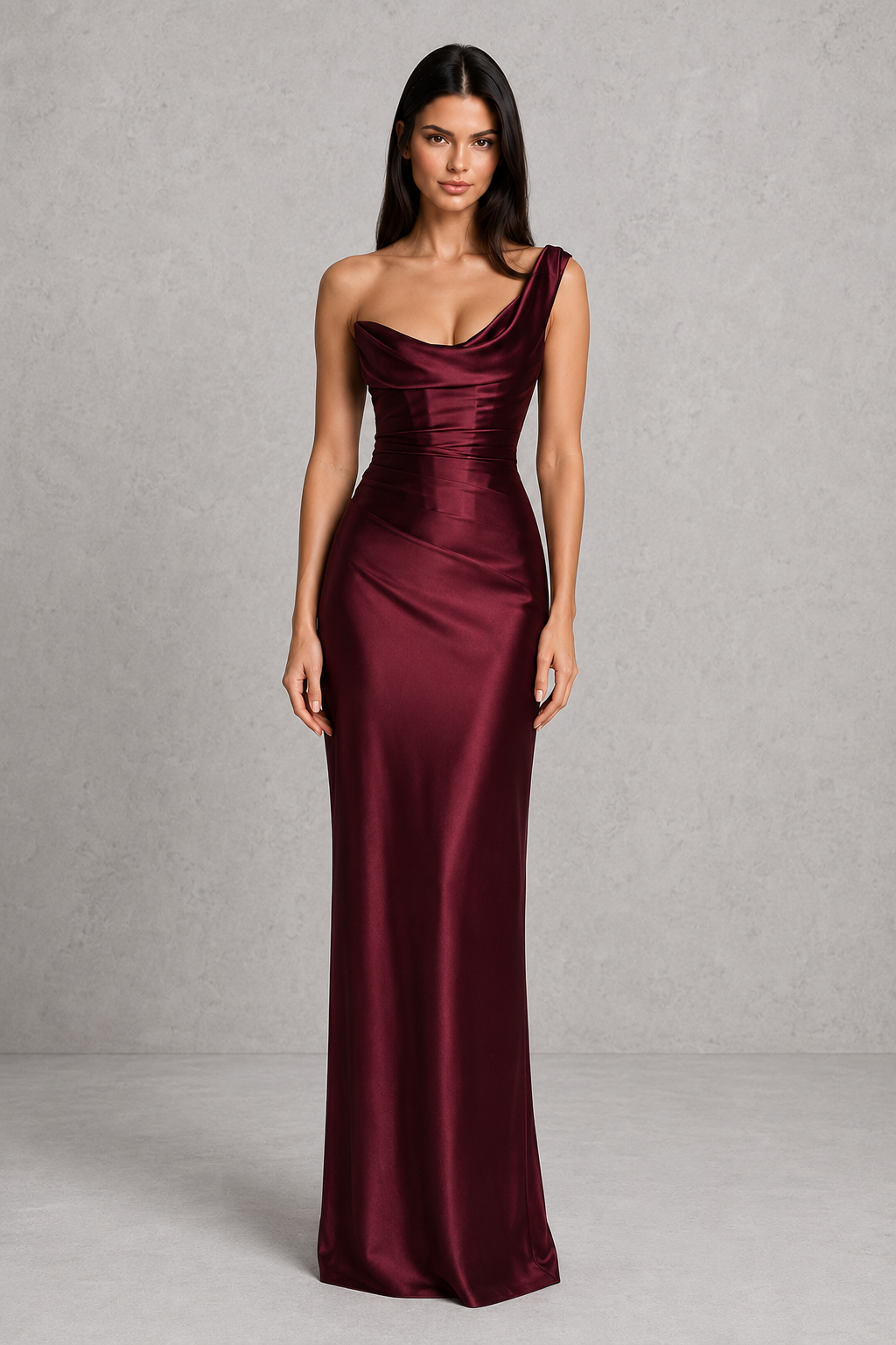 Woman wearing a one-shoulder satin maxi dress featuring a pleated cowl neckline, structured corset bodice with boning, asymmetrical draping, adjustable lace-up back, and a flowing bias-cut skirt, ideal for formal events, evening occasions, and special celebrations.
