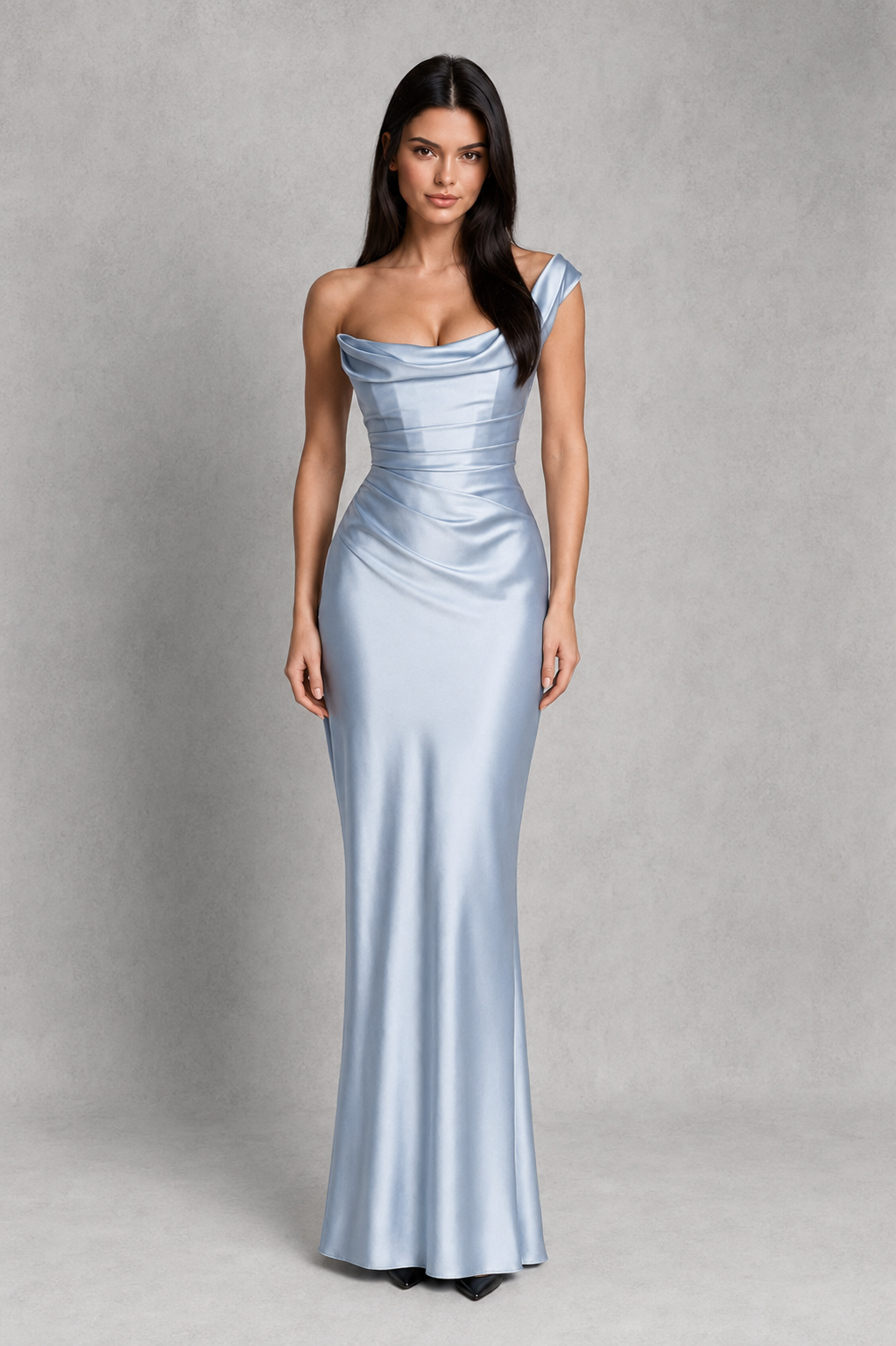 Woman wearing a one-shoulder satin maxi dress featuring a pleated cowl neckline, structured corset bodice with boning, asymmetrical draping, adjustable lace-up back, and a flowing bias-cut skirt, ideal for formal events, evening occasions, and special celebrations.