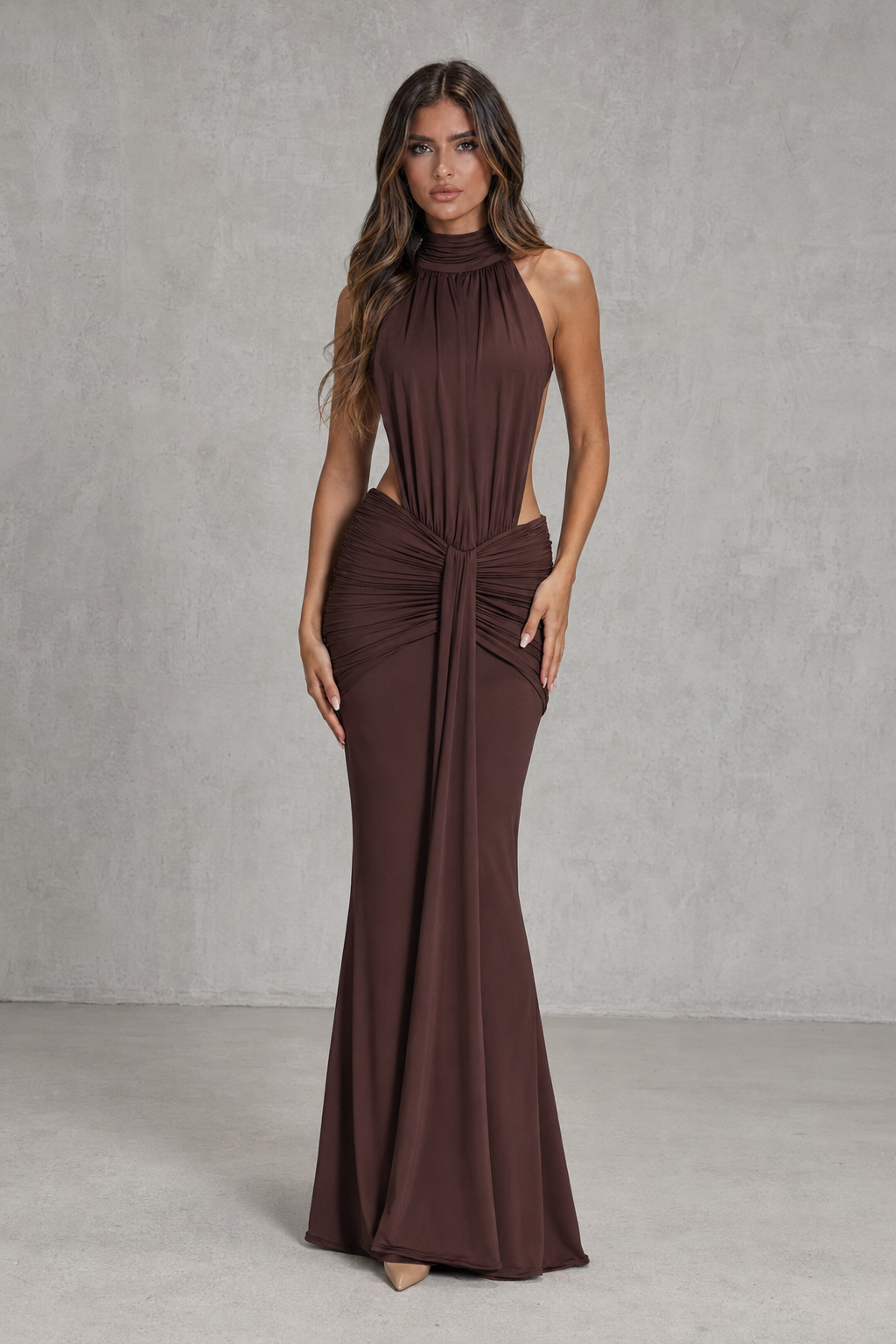 Women's open back mermaid maxi dress in smooth stretch fabric featuring a high neckline, fitted ruched silhouette, dramatic open back, and flowing mermaid skirt for evening and formal occasions.