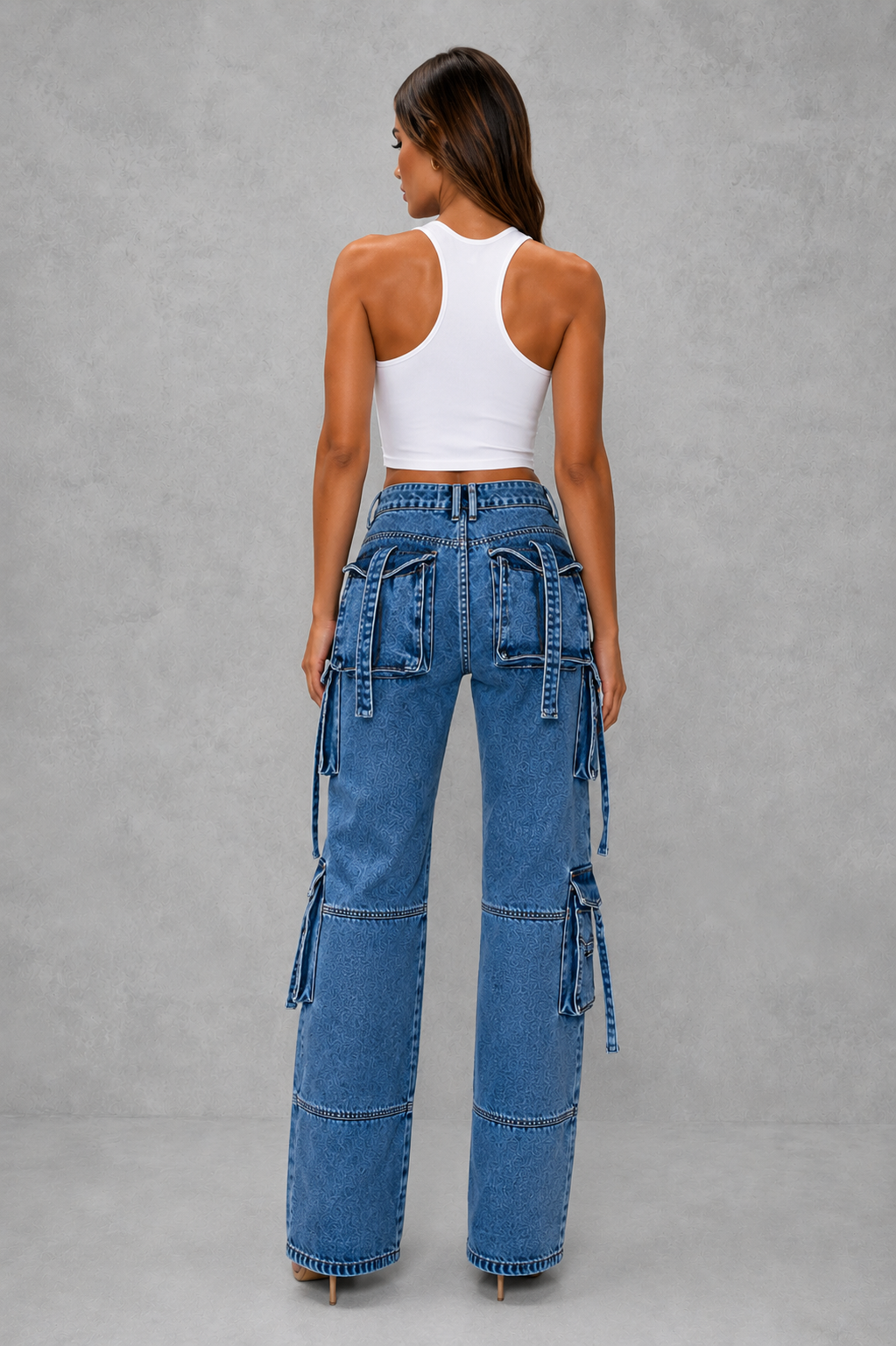 Women’s oversized wide leg denim cargo pants with dark wash finish, distressed detailing and multiple utility pockets for casual Y2K streetwear.