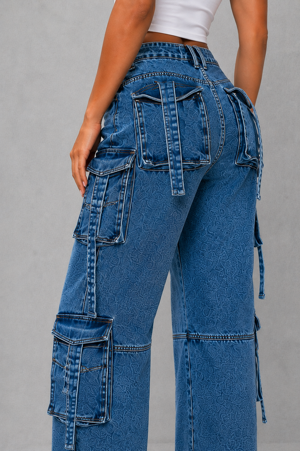 Women’s oversized wide leg denim cargo pants with dark wash finish, distressed detailing and multiple utility pockets for casual Y2K streetwear.
