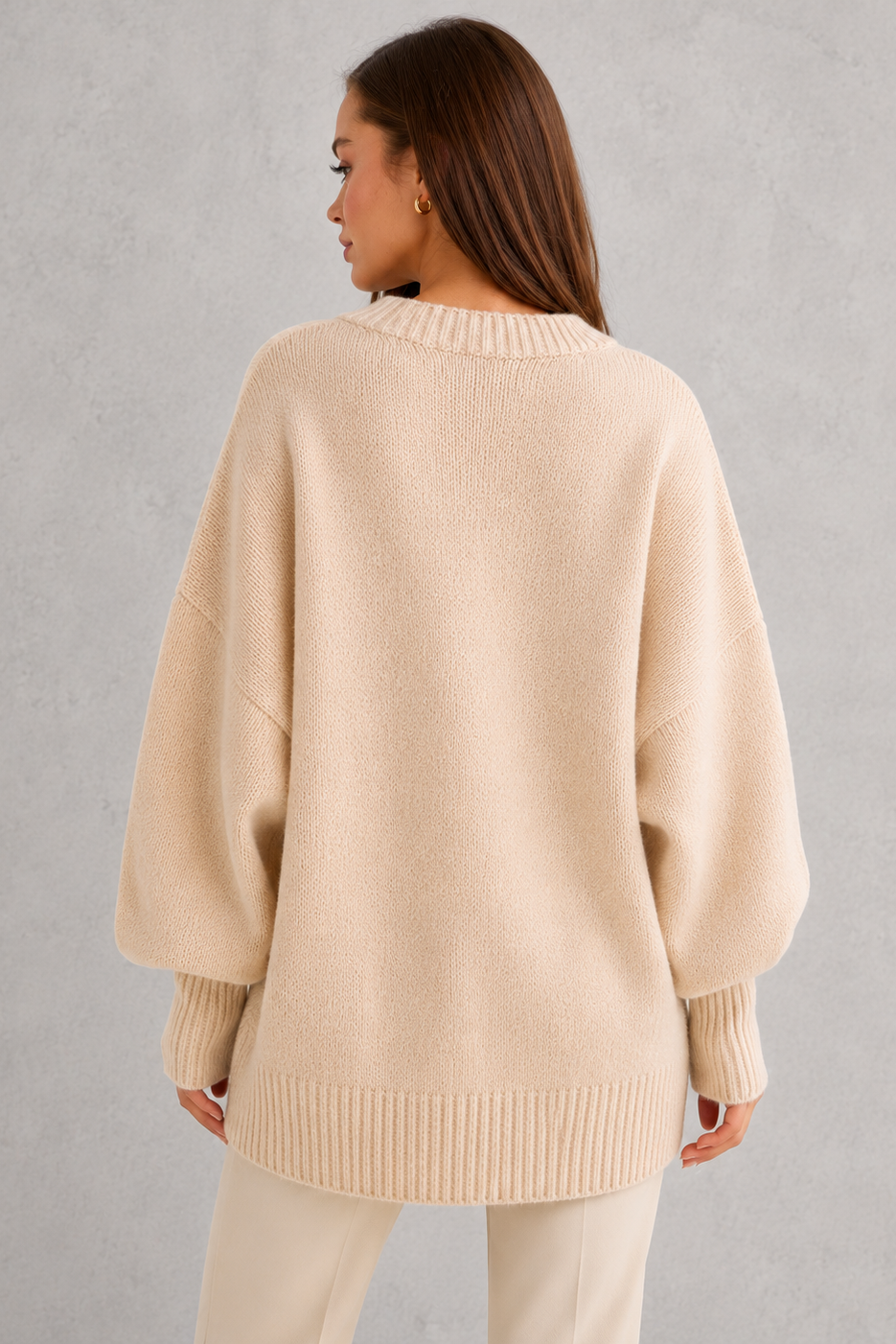 Women’s oversized wool blend sweater with asymmetrical hem, drop shoulders, and relaxed fit