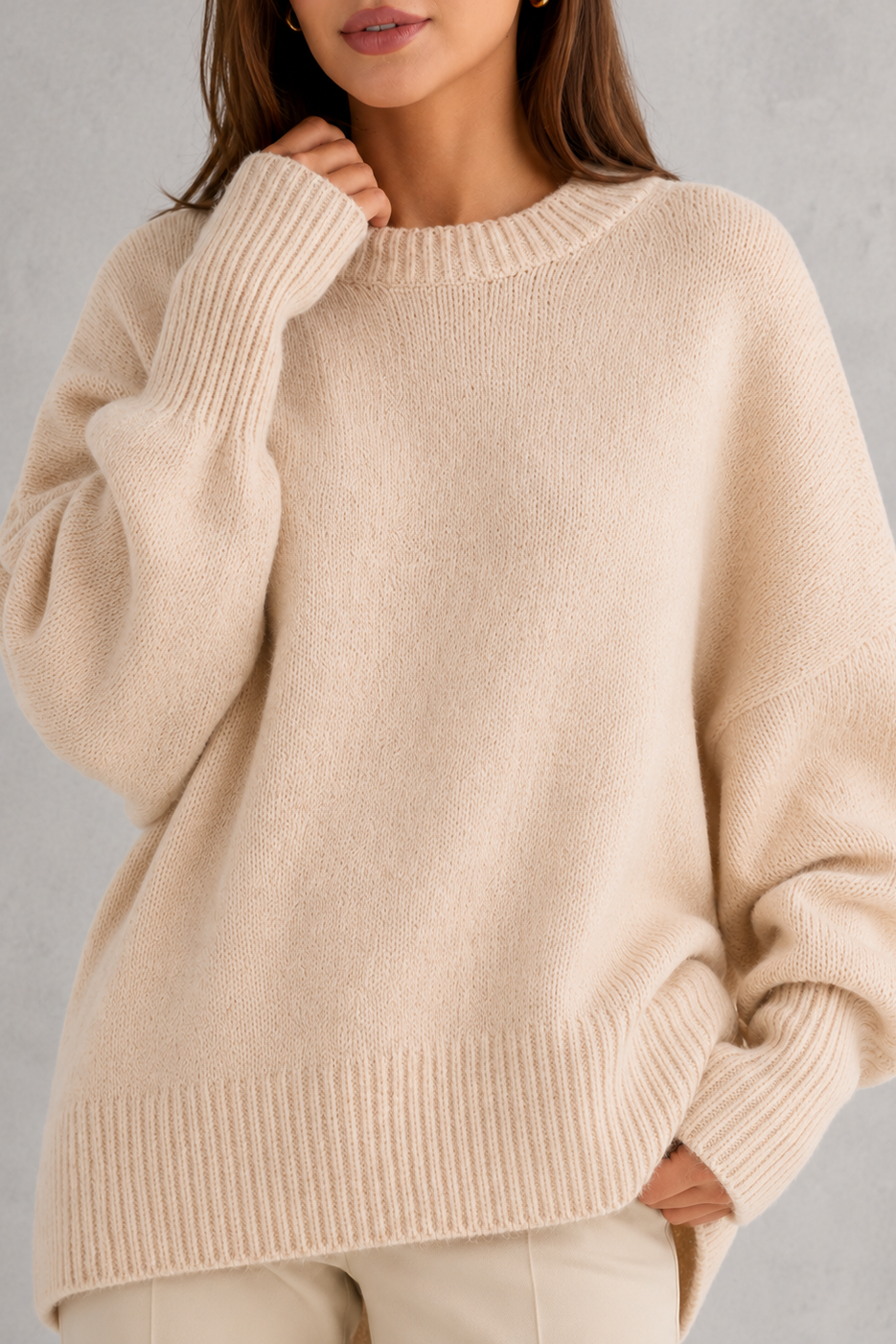 Women’s oversized wool blend sweater with asymmetrical hem, drop shoulders, and relaxed fit