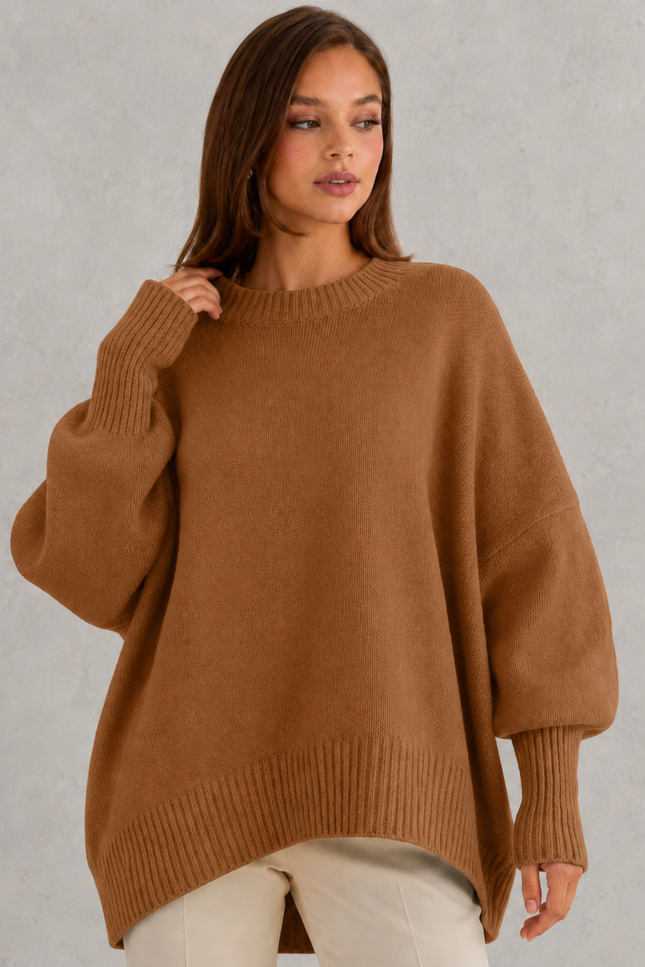 Women’s oversized wool blend sweater with asymmetrical hem, drop shoulders, and relaxed fit