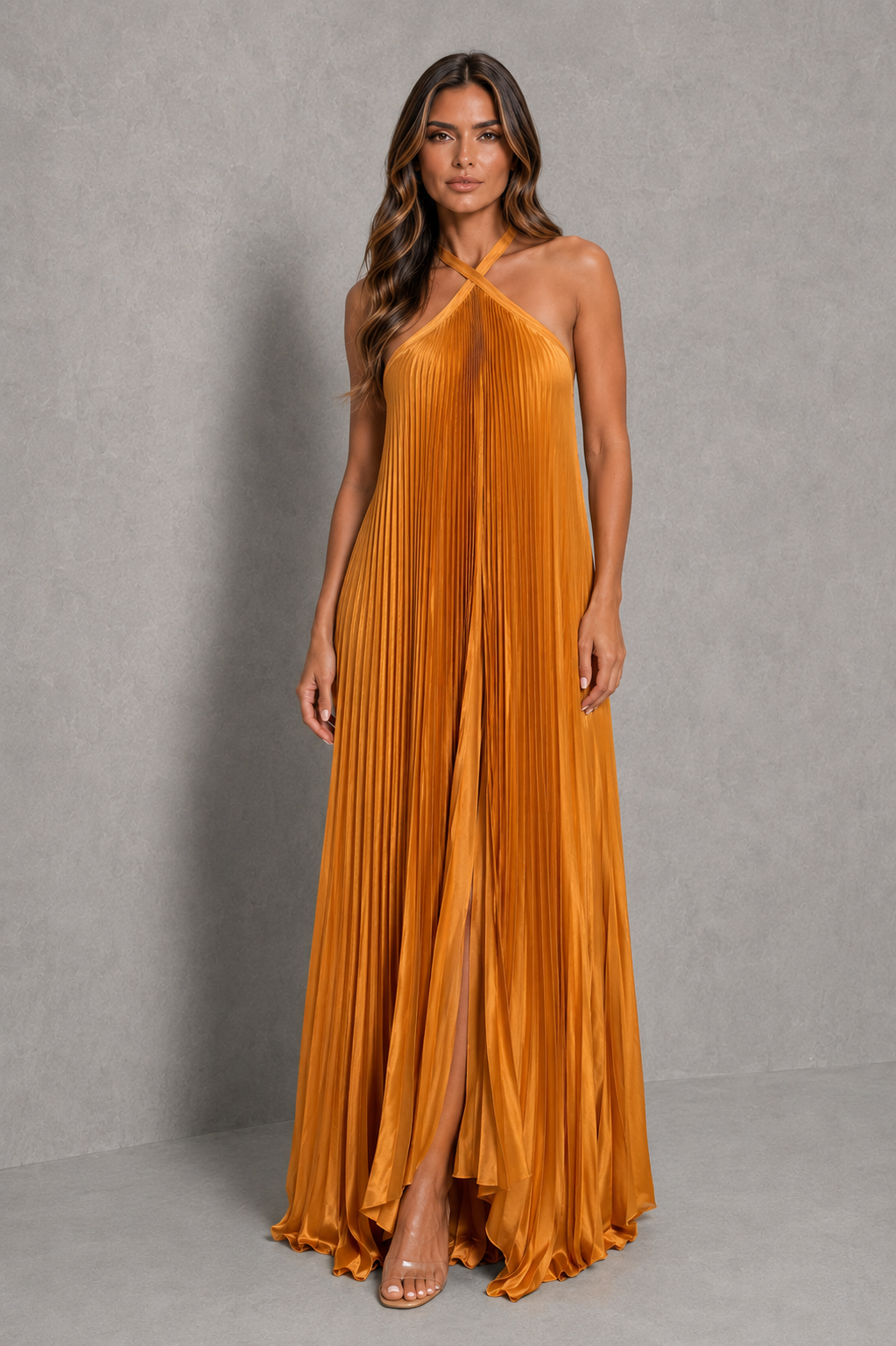 Women's pleated halterneck maxi dress with a cross-front neckline, open back with adjustable tie fastening, and flowing floor-length pleated skirt, ideal for wedding guests, formal occasions, and evening wear.