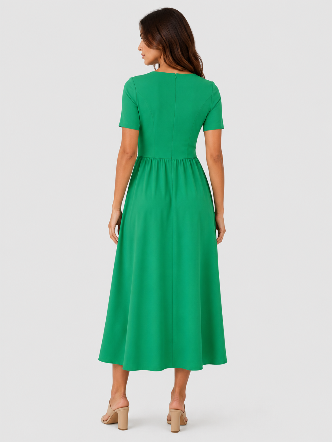 Women's relaxed-fit midi dress made from lightweight polyester fabric. Designed with a clean, versatile silhouette that falls below the knee, offering comfort and ease of movement for everyday wear. Suitable for casual outings or more polished occasions. Machine washable and true to size with light shaping through the fit.