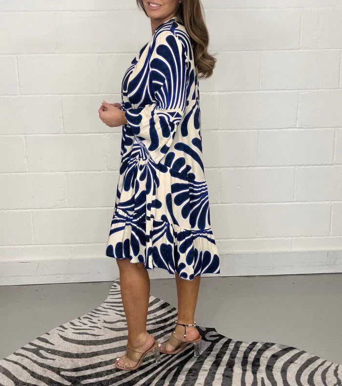 Women’s printed V-neck midi dress made from lightweight polyester blend fabric