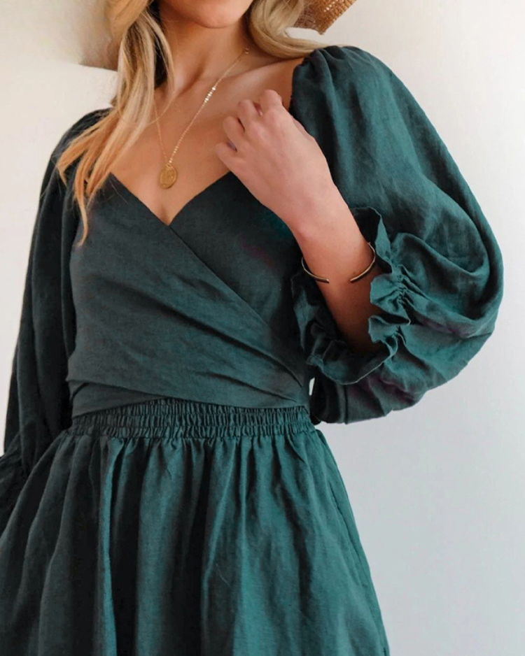 Women wearing midi dress with French ruffle sleeves and side cutout detail in slim fit silhouette