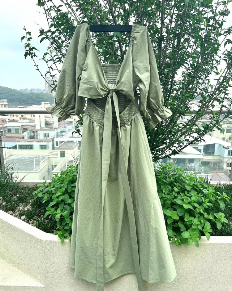 Women wearing midi dress with French ruffle sleeves and side cutout detail in slim fit silhouette