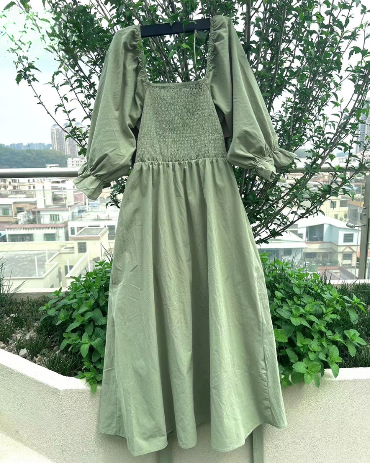 Women wearing midi dress with French ruffle sleeves and side cutout detail in slim fit silhouette