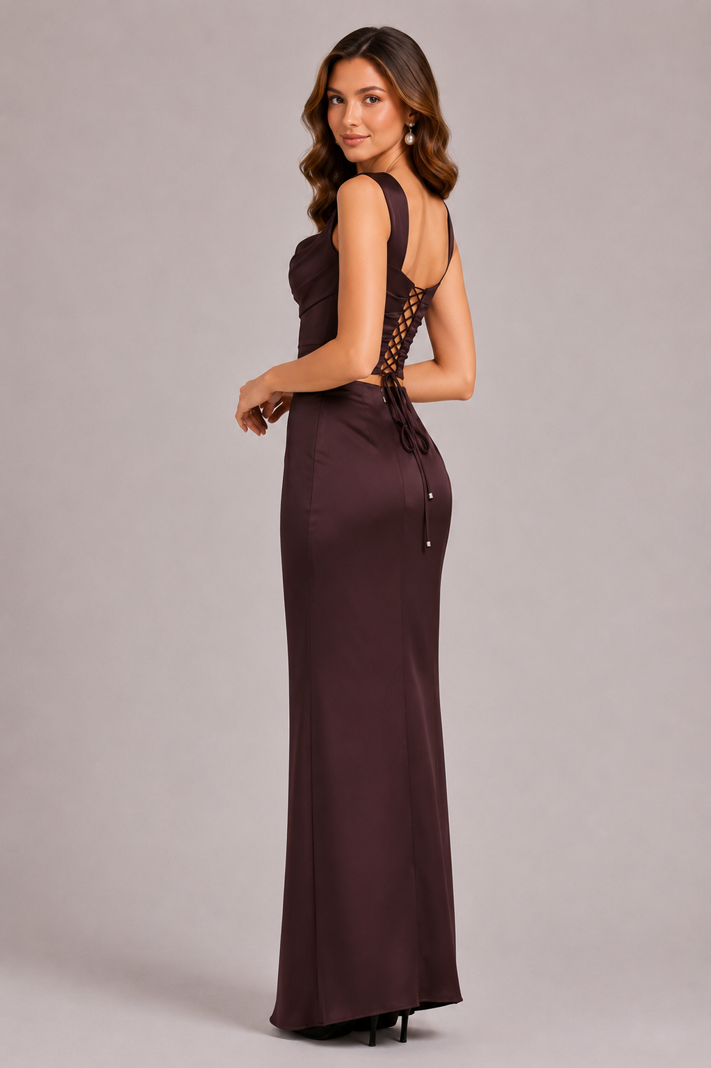 Women’s satin corset top with draped bust detail, structured boning, fitted silhouette, and adjustable lace-up back.
