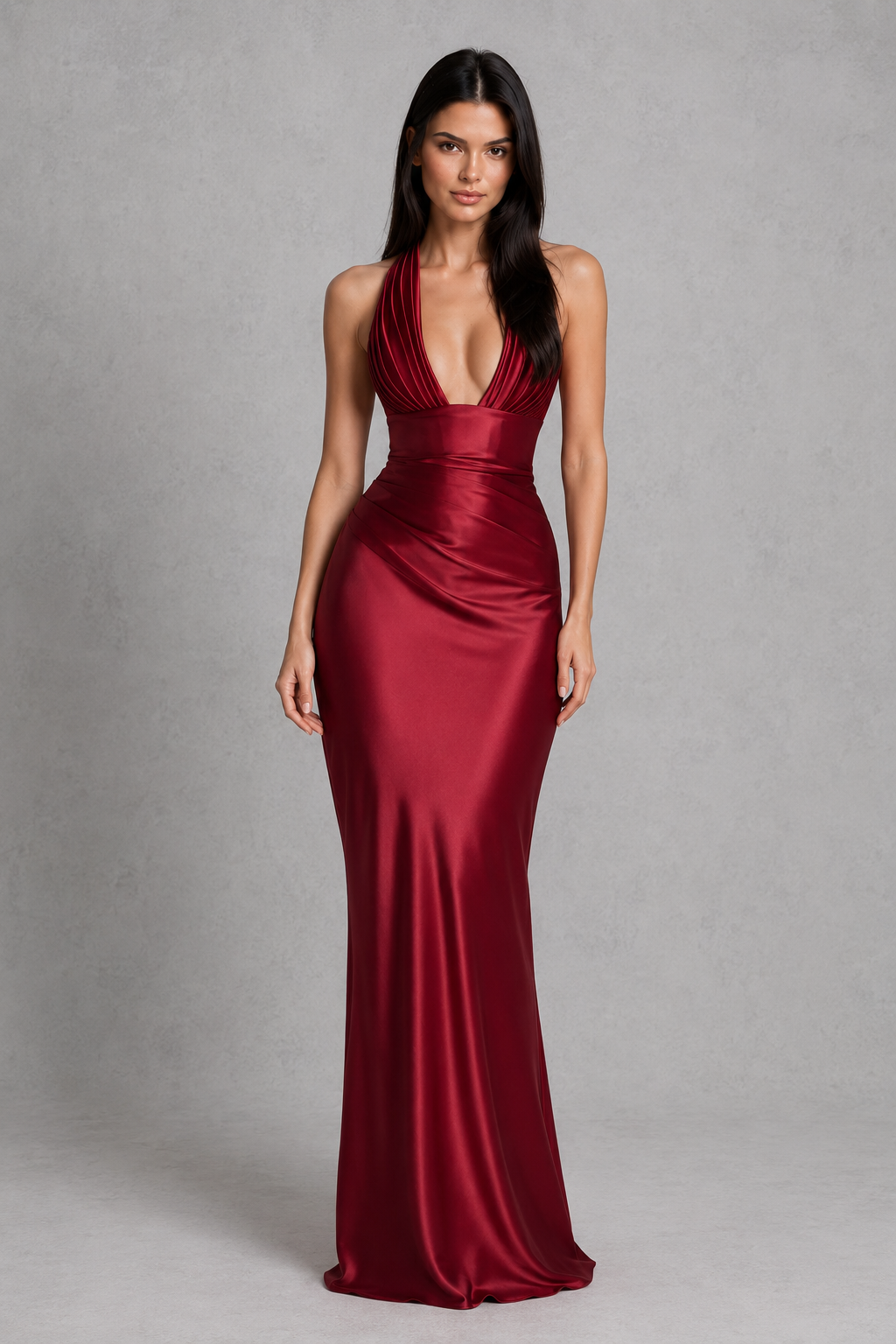 Women's satin halter maxi dress with a plunge neckline, sculptural pleated cups, asymmetric pleated bodice, and flowing bias-cut skirt. Features an internal corset bodice and adjustable lace-up back for a flattering, elegant silhouette ideal for evening events, formal occasions, and special celebrations.