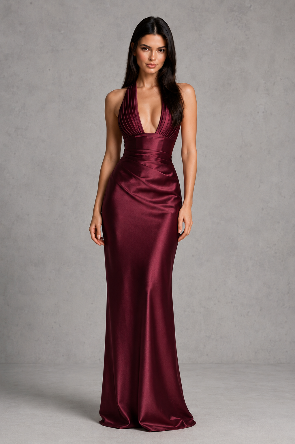 Women's satin halter maxi dress with a plunge neckline, sculptural pleated cups, asymmetric pleated bodice, and flowing bias-cut skirt. Features an internal corset bodice and adjustable lace-up back for a flattering, elegant silhouette ideal for evening events, formal occasions, and special celebrations.