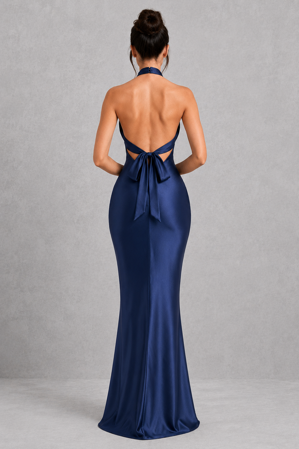 Elegant women's satin maxi dress featuring a high neckline, open back with adjustable tie, and full-length flowing skirt for formal occasions.