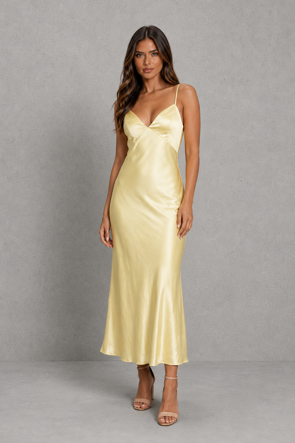 Women's elegant satin slip maxi dress with adjustable cross-back straps, a relaxed draped silhouette and a smooth satin-look finish for weddings, evenings and special occasions.
