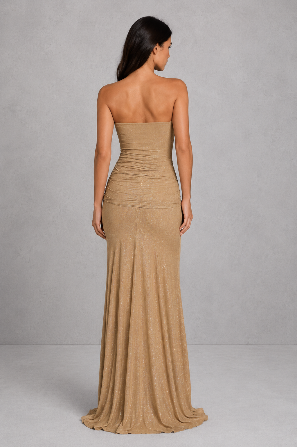 Women's strapless glitter maxi dress with ruched waist detail, fitted bodice, semi-sheer mesh bodice panel, fit-and-flare skirt, and shimmering finish for evening parties, formal events, and special occasions.