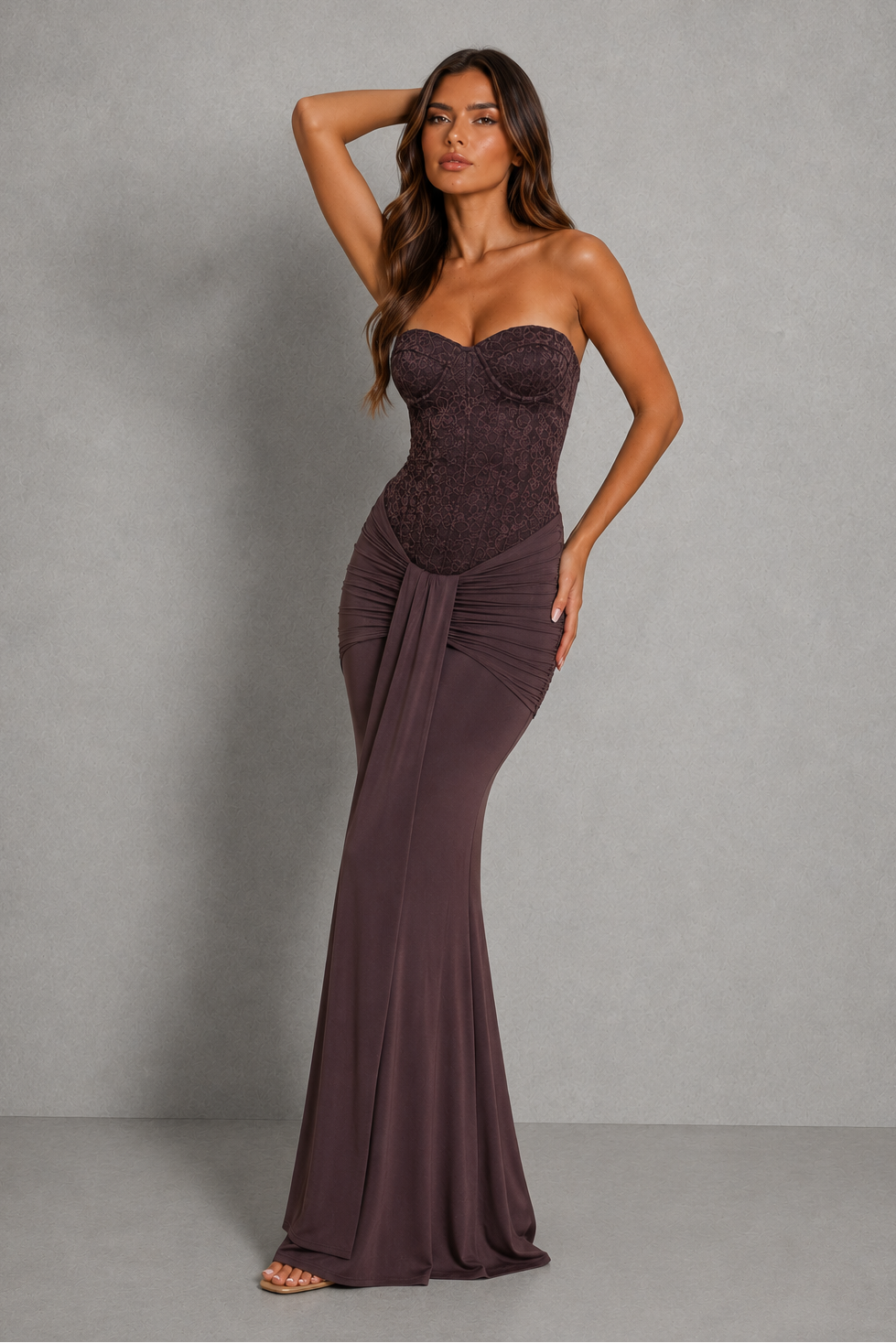 Strapless lace corset maxi dress with structured underwire bodice, ruched hip detailing, and an elegant flowing floor-length skirt.