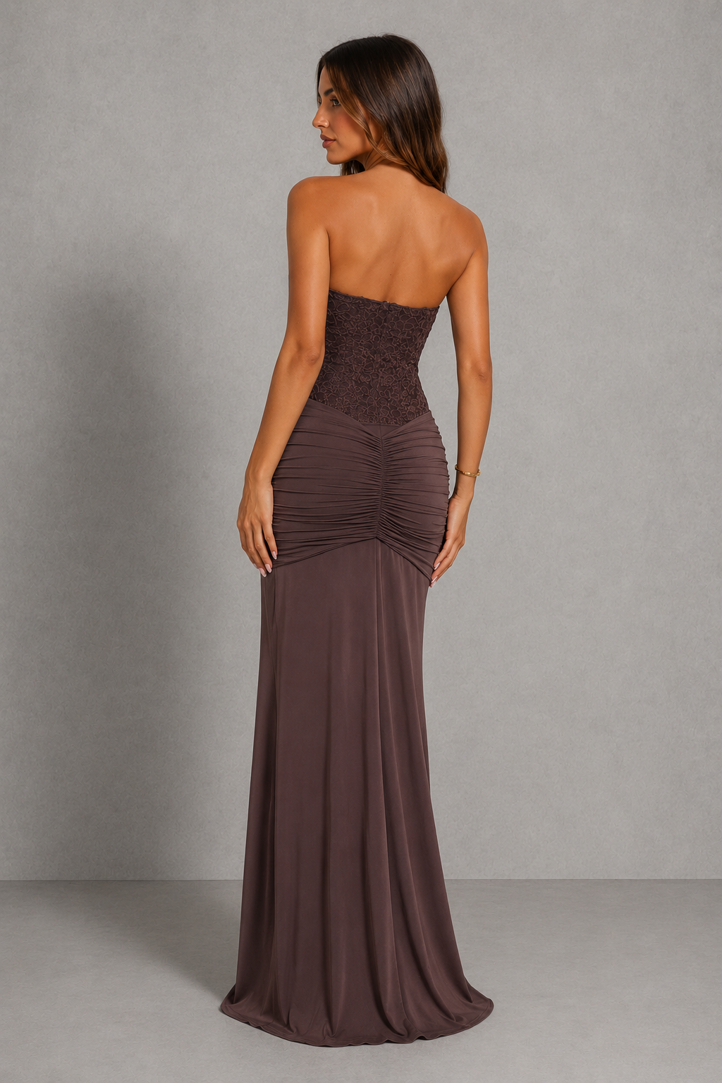 Strapless lace corset maxi dress with structured underwire bodice, ruched hip detailing, and an elegant flowing floor-length skirt.