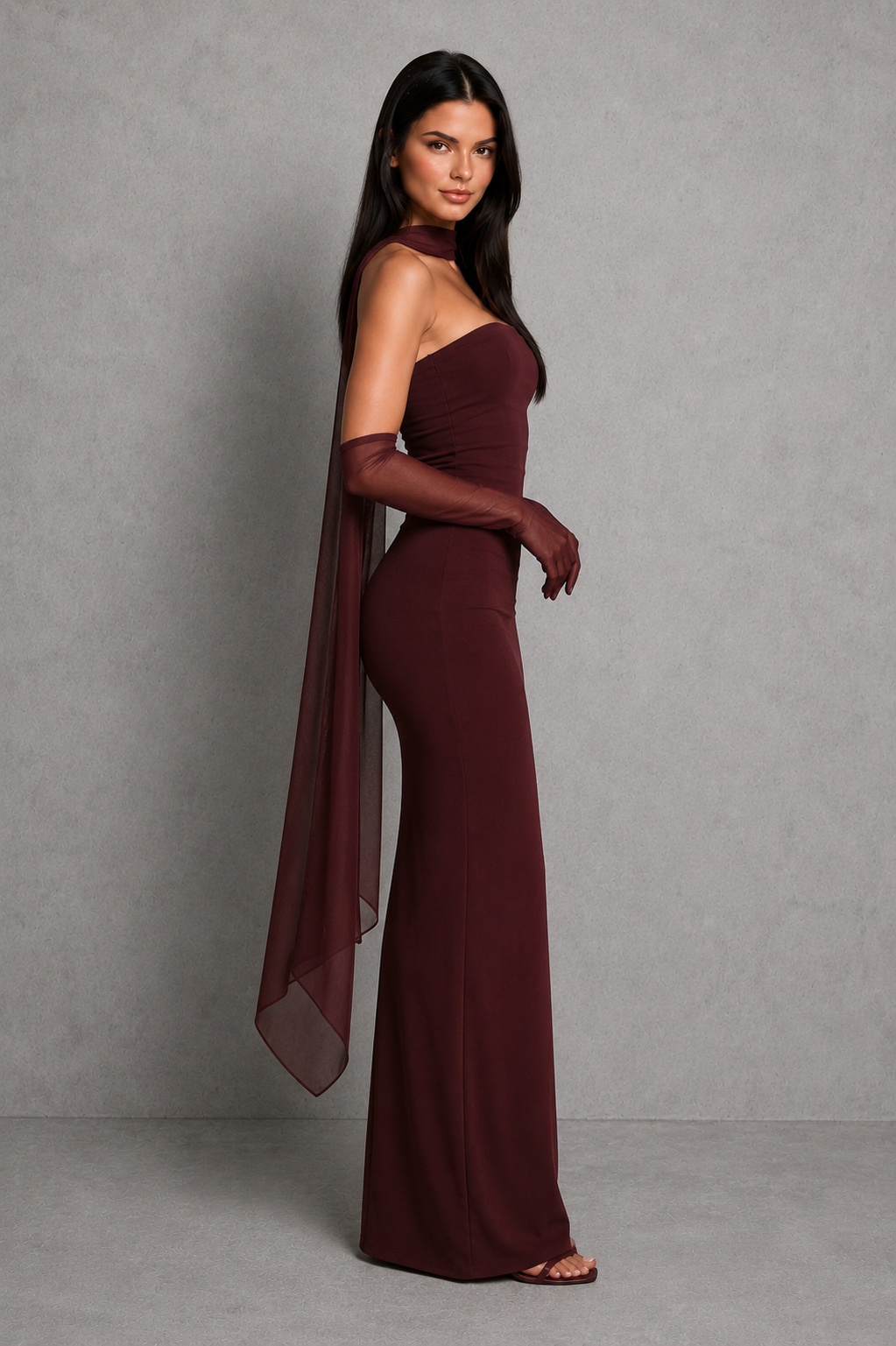 Women’s strapless maxi evening dress in premium crepe fabric featuring a pleated bodice, fitted column skirt, centre back split, and removable mesh halter strap with matching mesh scarf for versatile formal styling.