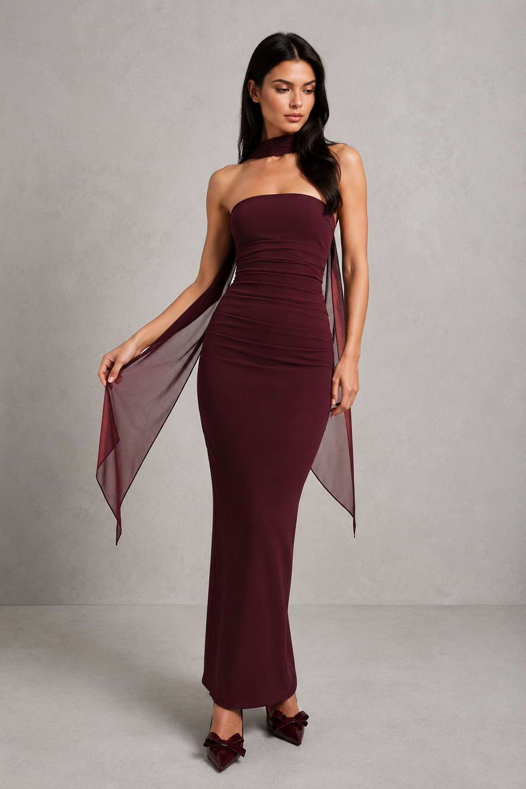 Women’s strapless maxi evening dress in premium crepe fabric featuring a pleated bodice, fitted column skirt, centre back split, and removable mesh halter strap with matching mesh scarf for versatile formal styling.
