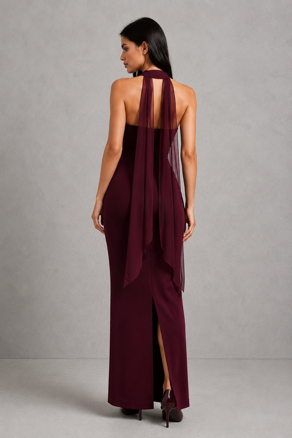 Women’s strapless maxi evening dress in premium crepe fabric featuring a pleated bodice, fitted column skirt, centre back split, and removable mesh halter strap with matching mesh scarf for versatile formal styling.