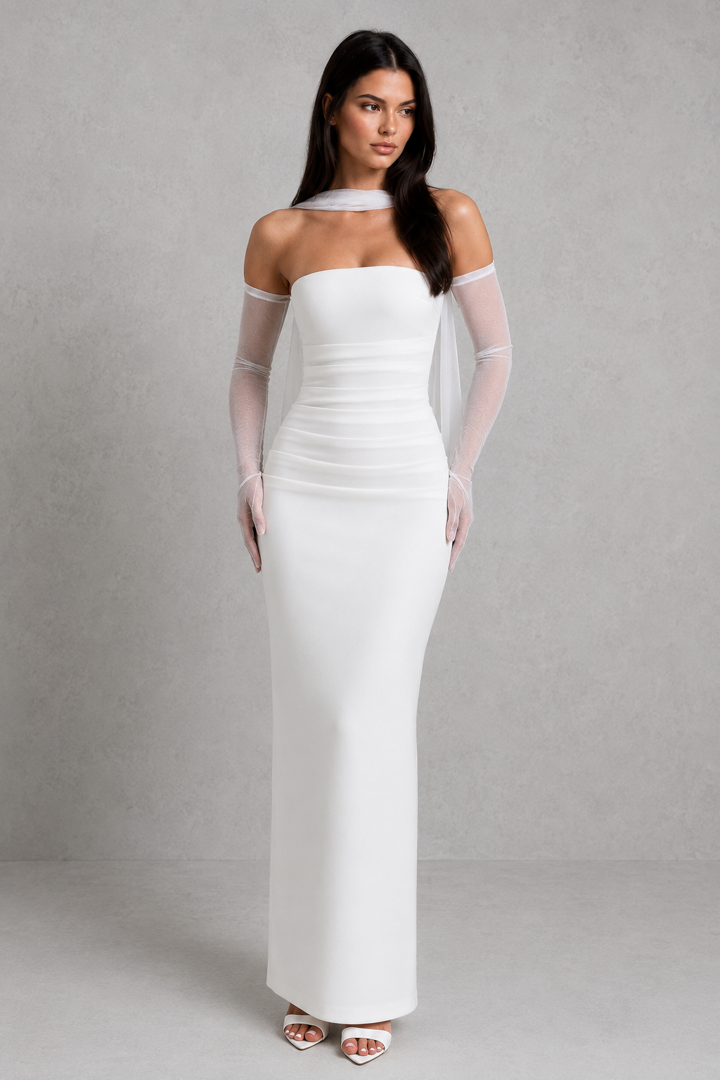 Women’s strapless maxi evening dress in premium crepe fabric featuring a pleated bodice, fitted column skirt, centre back split, and removable mesh halter strap with matching mesh scarf for versatile formal styling.