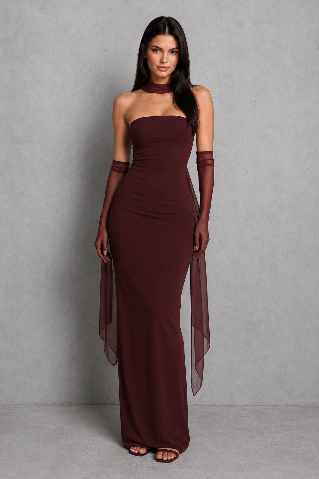 Women’s strapless maxi evening dress in premium crepe fabric featuring a pleated bodice, fitted column skirt, centre back split, and removable mesh halter strap with matching mesh scarf for versatile formal styling.